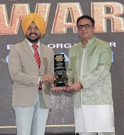 Tajinder Bains receiving a business award